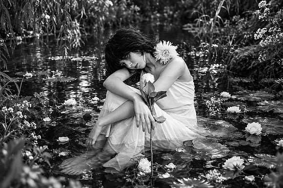 Melancholic Ophelia in a White Rose Pond