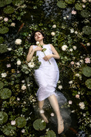 Dreamy Woman Floating Among Water Lilies